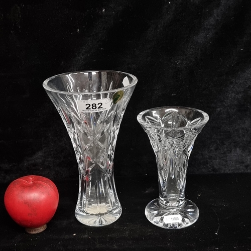 282 - Two Waterford Crystal vases including a Kilrane example and a Millennium Happiness example. Both wit... 