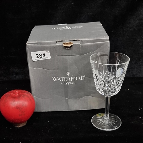 284 - Four Waterford Crystal stemmed wine glasses in the Lismore pattern. With original box and in very go... 