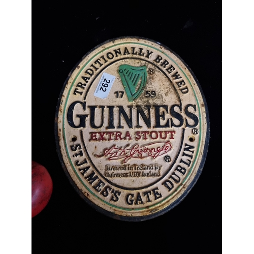 292 - A cast metal Guinness advertising plaque.