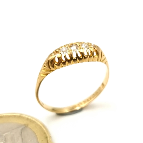 4 - Star Lot : A very attractive 18 carat gold four stone diamond ring, featuring an intricately crafted... 