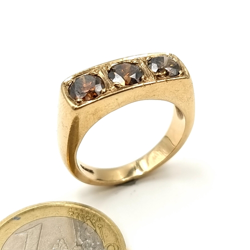 5 - Star Lot : A mesmerising substantial 9 carat gold generous three stone natural Topaz ring, featuring... 