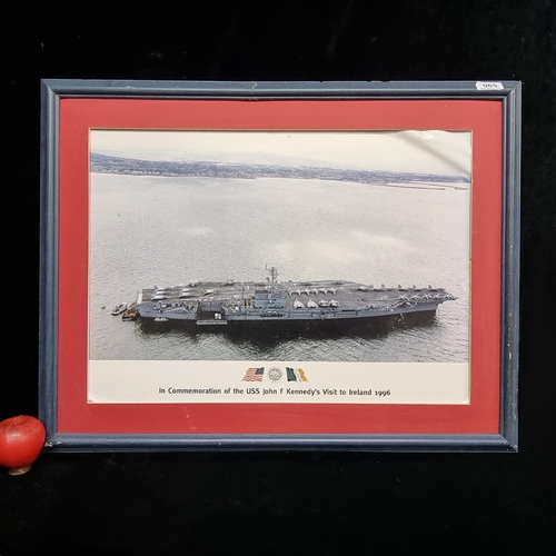 65 - A large framed print of a US aircraft carrier commemorating John F. Kennedy's visit to Ireland 1996.