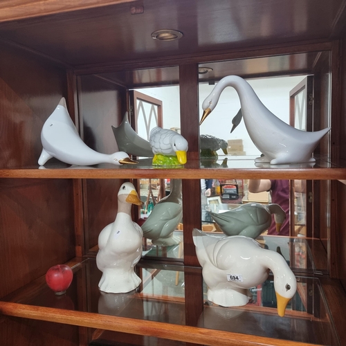 694 - Five characterful ceramic figures of geese.