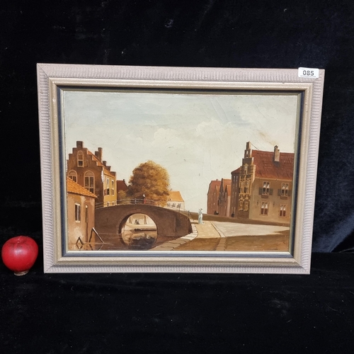 85 - An early 20th century oil on canvas painting showing a finely rendered Dutch street scene in sepia t... 