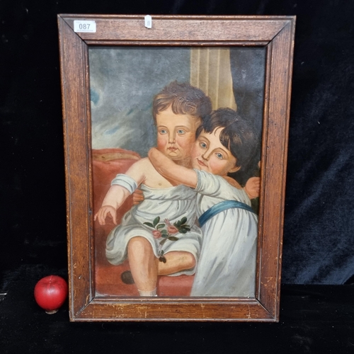 87 - An antique original oil on canvas board a cherub like child and his adoring sister in an art deco st... 