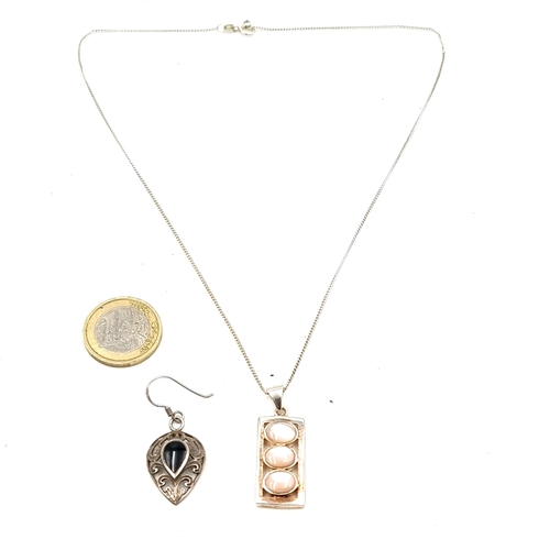 891 - Two sterling silver items including a single earring along with a pendant necklace set with three op... 