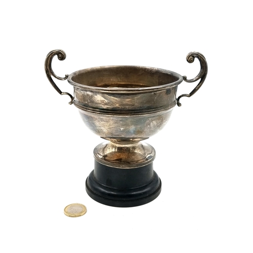 898 - A vintage Birmingham sterling silver trophy accompanied by a pedestal. Weight: 218.19g.