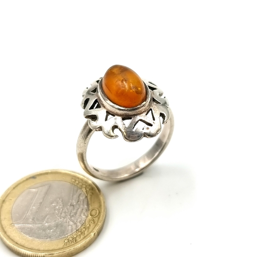 920 - Very handsome Sterling Silver ring with a cabochon natural Amber stone.