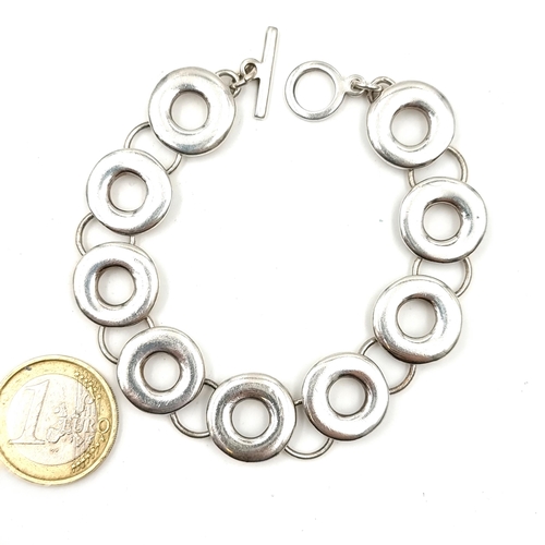 924 - A substantial Silver bracelet with round polo style discs. 31g