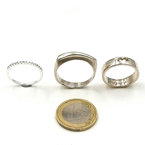 925 - A very pretty sterling silver half eternity ring (ring size Q 1/2) along with a pierced silver examp... 