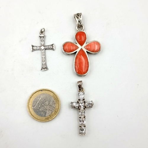 927 - Three sterling silver cruciform / cross pendants including a particularly nice etched example.
Total... 