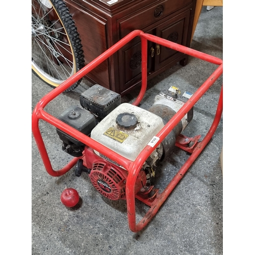 939 - A large Honda GX160 5.5 petrol generator with metal frame. With internet comps of €320.06 on ebay.ie