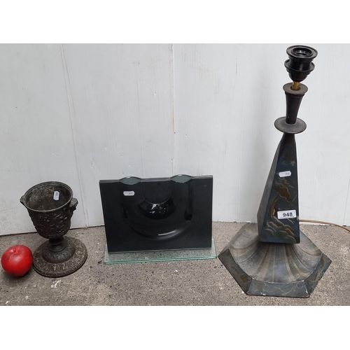 948 - A trio of household items including a stylish table lamp and cast metal urn.