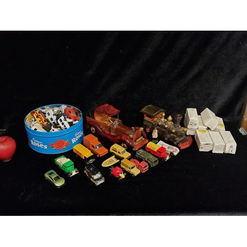 304 - A box containing a large number of vintage toys cars including a selection of boxed Corgi examples.