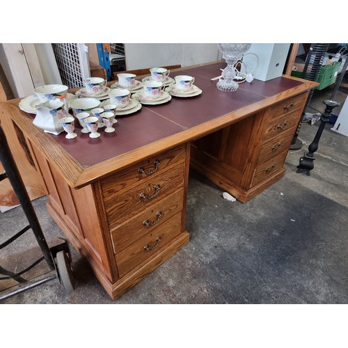 950 - Star Lot : A fabulous oak Directors desk with ox blood tooled leather top, super quality and in very... 