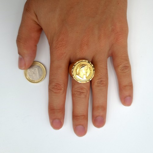 3 - A striking heavy, wide banded Napoleonic III large gold signet ring, set with diamond cut surround. ... 