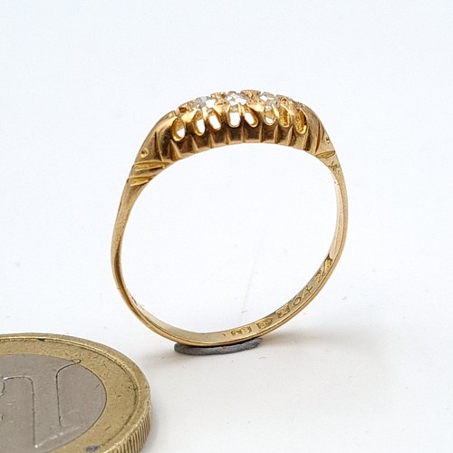 4 - Star Lot : A very attractive 18 carat gold four stone diamond ring, featuring an intricately crafted... 