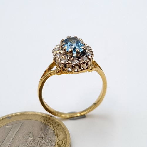 6 - Star Lot: A truly beautiful vintage 18 carat gold Aquamarine cluster ring, set with a generous halo ... 