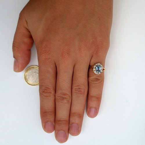 6 - Star Lot: A truly beautiful vintage 18 carat gold Aquamarine cluster ring, set with a generous halo ... 