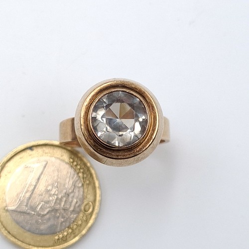 8 - Star Lot : An unusual substantial gold ring stamped 333 and featuring a graduated generous setting a... 