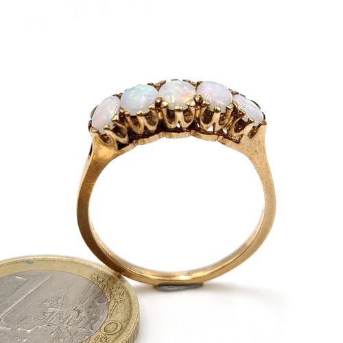 14 - Star Lot : A beautiful vintage 9 carat gold Fire Opel five stone ring, set with an intricate crown m... 