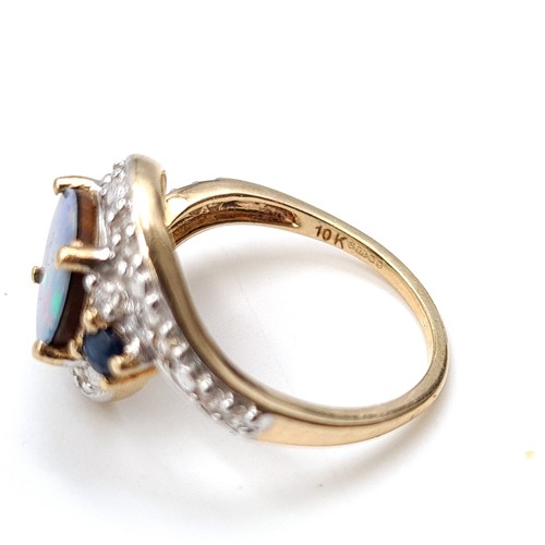 15 - Star Lot : A fabulous example of a vintage 10 carat gold generous Blue fire Opal stone ring, set wit... 