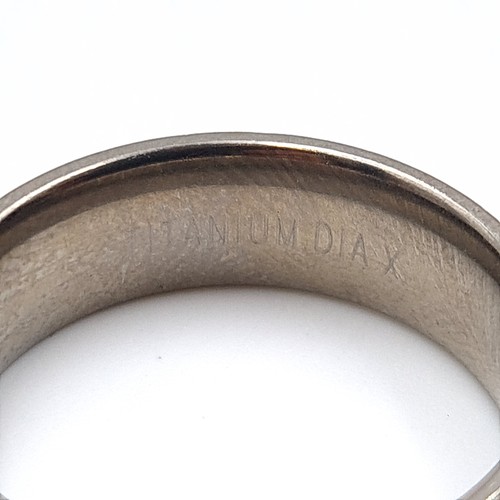 24 - A gents titanium Diamond ring, stamped 