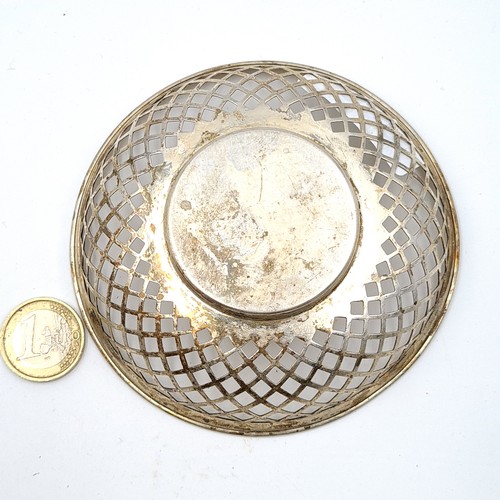 36 - A circular antique lattice sterling silver raised dish. Hallmarked Birmingham, circa 1918. Makers ma... 