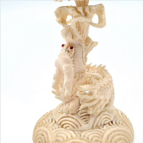 60 - A finely carved Japanese antique natural material puzzle ball and pedestal. Combined height: 13cm. W... 