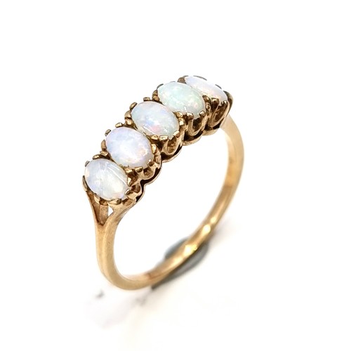 14 - Star Lot : A beautiful vintage 9 carat gold Fire Opel five stone ring, set with an intricate crown m... 