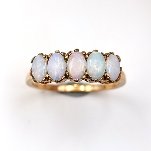 14 - Star Lot : A beautiful vintage 9 carat gold Fire Opel five stone ring, set with an intricate crown m... 