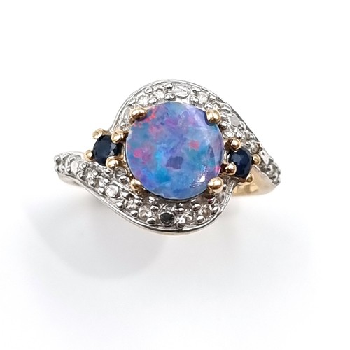 15 - Star Lot : A fabulous example of a vintage 10 carat gold generous Blue fire Opal stone ring, set wit... 