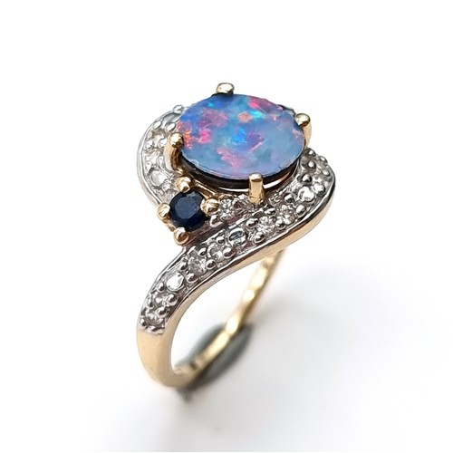 15 - Star Lot : A fabulous example of a vintage 10 carat gold generous Blue fire Opal stone ring, set wit... 