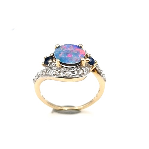 15 - Star Lot : A fabulous example of a vintage 10 carat gold generous Blue fire Opal stone ring, set wit... 