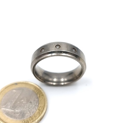 24 - A gents titanium Diamond ring, stamped 