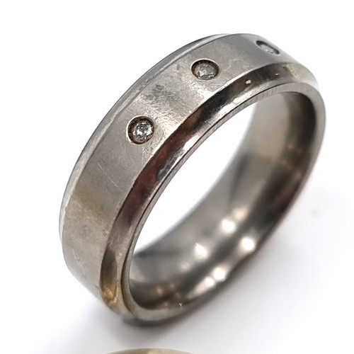 24 - A gents titanium Diamond ring, stamped 