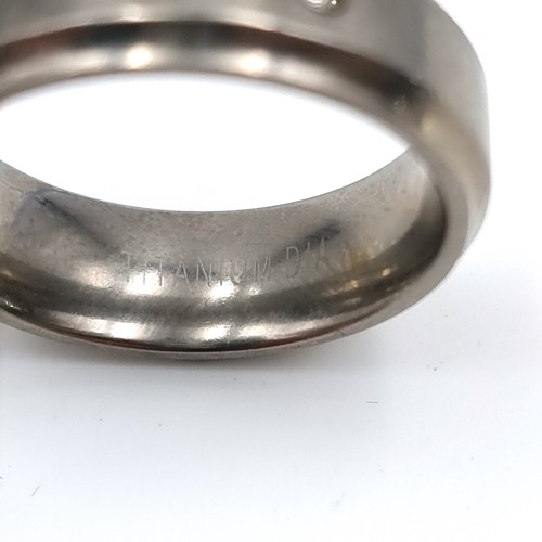 24 - A gents titanium Diamond ring, stamped 