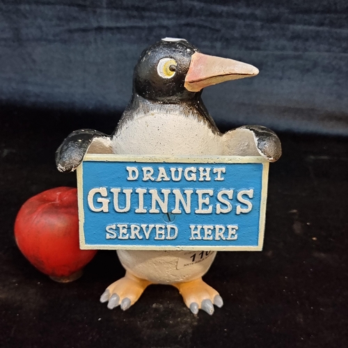 110 - A very heavy cast metal Guinness advertising money box in the form of a penguin.