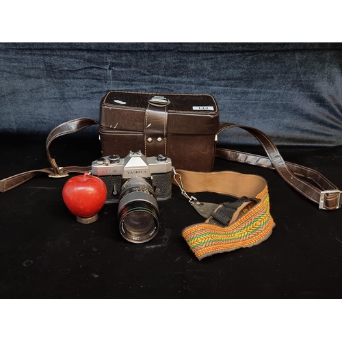 144 - A fantastic vintage Yashica TL-Electro camera with a beautiful strap, along with a Hanimar auto lens... 