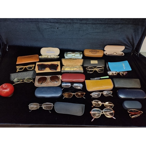 158 - A collection of twenty vintage reading glasses.