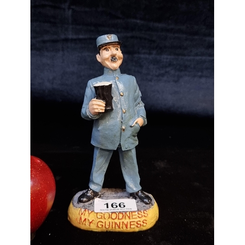 166 - A cast metal Guinness figure titled 