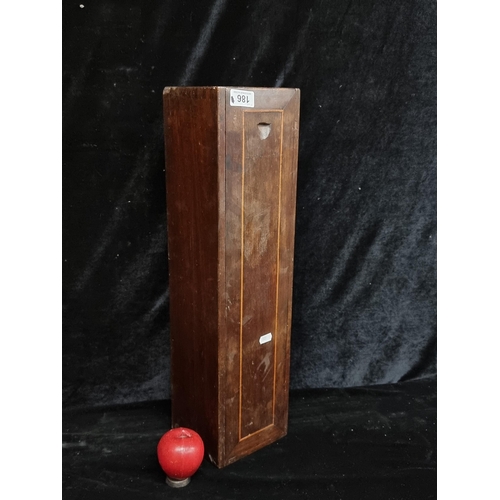 186 - An antique handsome wooden box . Featuring a slide out panel. H58cm