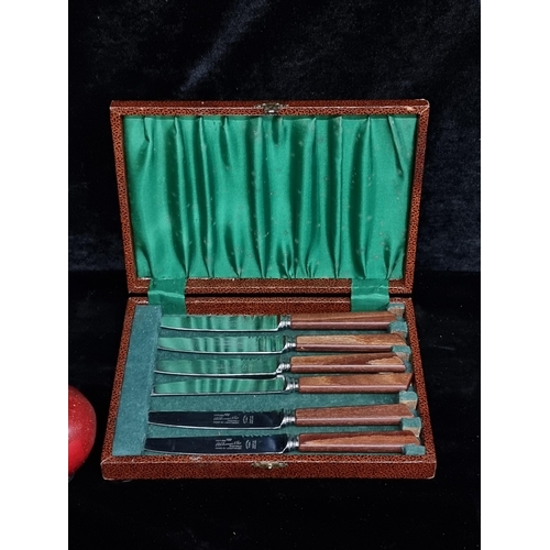 202 - A vintage canteen containing six B. Thomas & Co. knives with wooden handles. Held in original presen... 