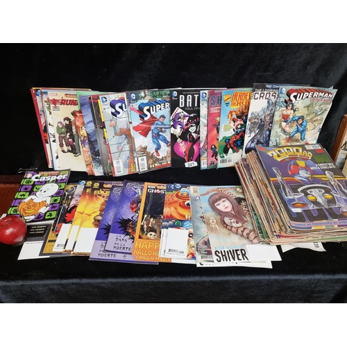 221 - A selection of comic books including Marvel, DC and 2000AD examples. With titles such as 'Batman', '... 