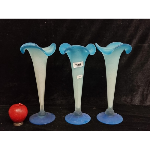 235 - A trio of studio art glass vases with pleated tops in a frosted blue finish.