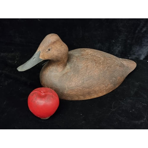 252 - A very charming carved wooden sculpture of a duck. Signed indistinctly to base and dated to 2005.