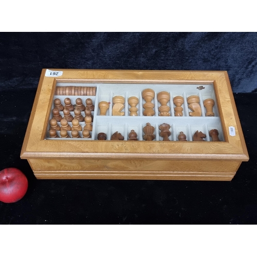 261 - An elegant complete chess and checkers set comprising of a wooden box with a glass panel, a shelf ho... 