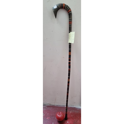 271 - A fabulous rare vintage walking stick constructed of horn and lacquered wood rings.