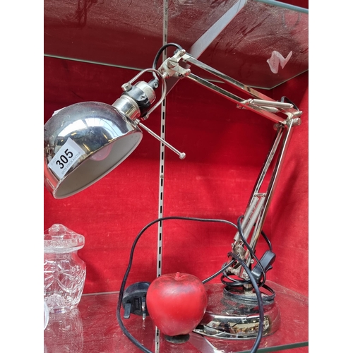 305 - A super retro style chromed articulated anglepoise desk lamp. Featuring a domed shade, heavy base, a... 