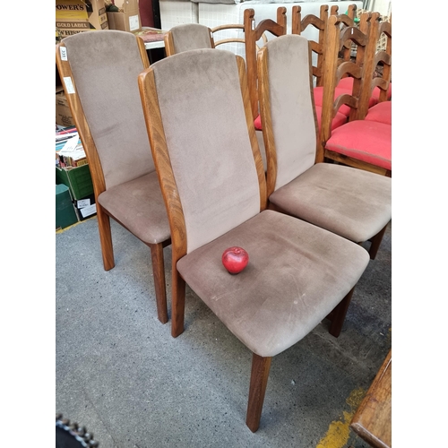 335 - A magnificent set of four mid century G Plan teak dining chairs. Upholstered with a caspian brown se... 